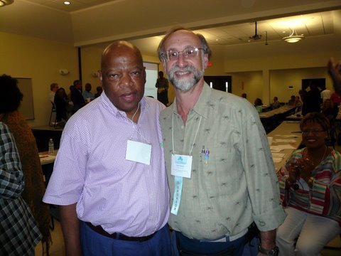 two men wearing dres shirts and name tags around their necks.